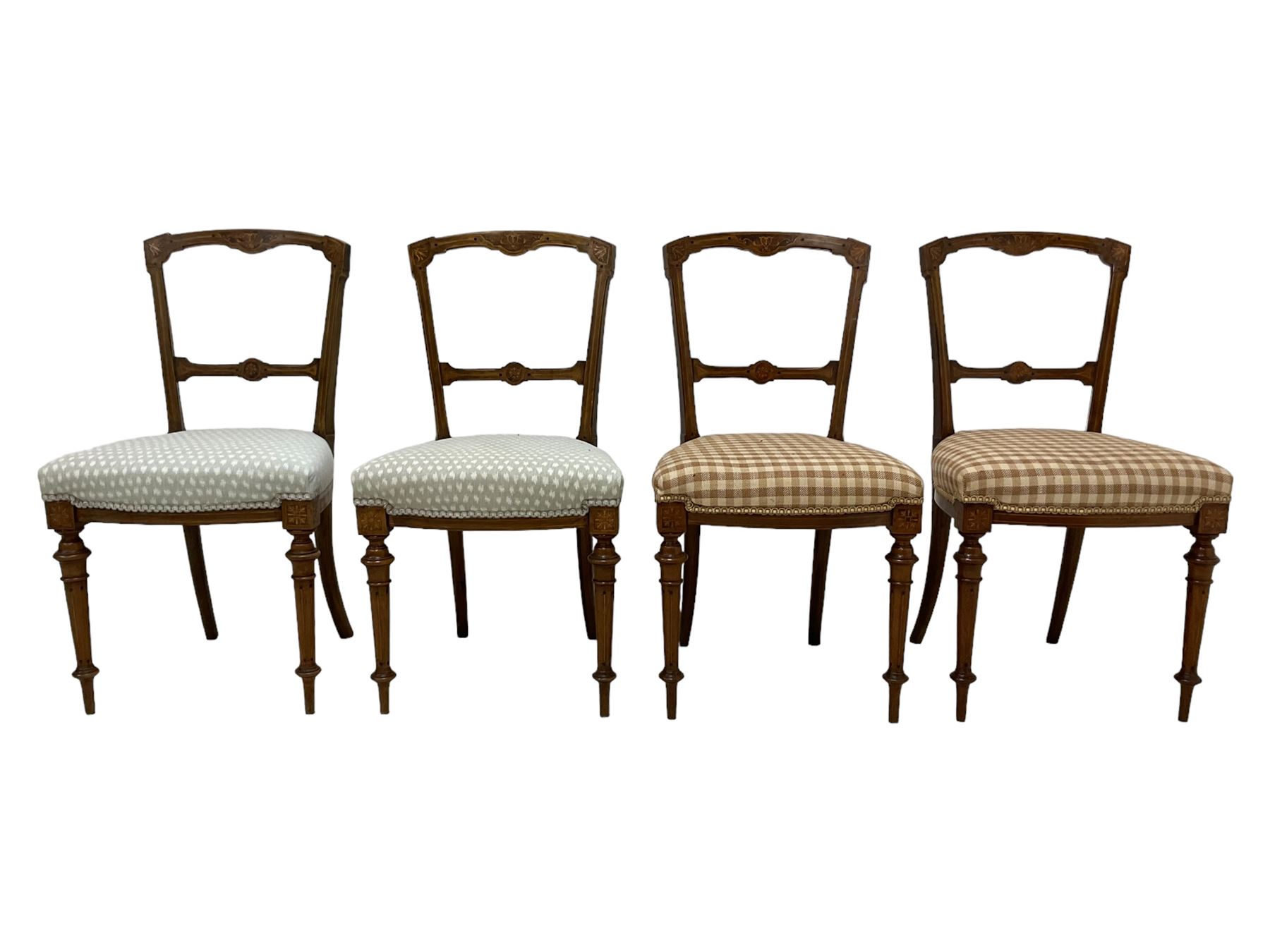 Set of five Victorian Aesthetic Movement inlaid walnut dining chairs, cresting rail and centre bar decorated with scrolling foliate inlays, raised on turned tapering supports with satinwood stringing