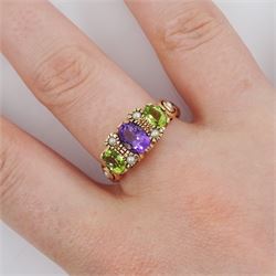 9ct rose gold three stone oval cut peridot and amethyst ring, with pearl accents set between and pearl set shoulders, London 2011