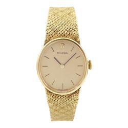 Omega ladies 9ct gold manual wind wristwatch, oval champagne dial with baton hour markers, Cal. 625, on integral 9ct gold bracelet, London 1977/78, boxed with papers