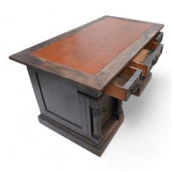 Late Victorian oak twin pedestal desk, rectangular moulded top with brown leather inset, three drawers fitted with Aesthetic Movement angular handles, each pedestal enclosed by door with turned columns, on moulded plinth base 