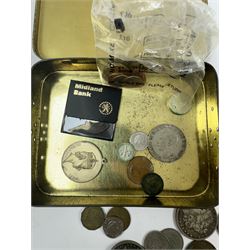 Various coins and banknotes including two Morgan dollars, in a vintage tin