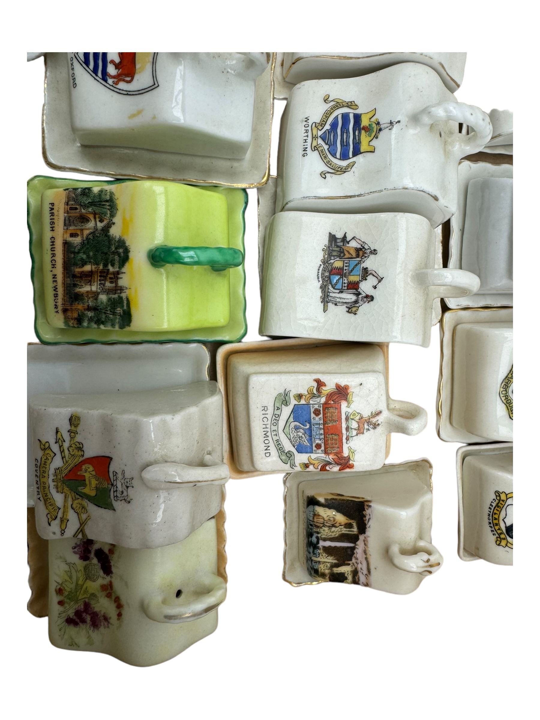 Collection of crested ware miniature cheese dishes and covers, including one by Goss, in one box