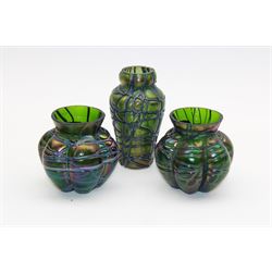 Three Austrian Art Nouveau Kralik iridescent glass vases, to include two of squat baluster form and a taller example, all green with threaded vein decoration to body, tallest H13.5cm