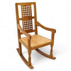 Mouseman - oak rocking armchair, double pierced and carved high lattice back, upholstered ...