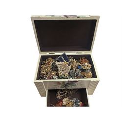 Collection of costume brooches, including ceramic, novelty and animal examples, contained within a white jewellery box