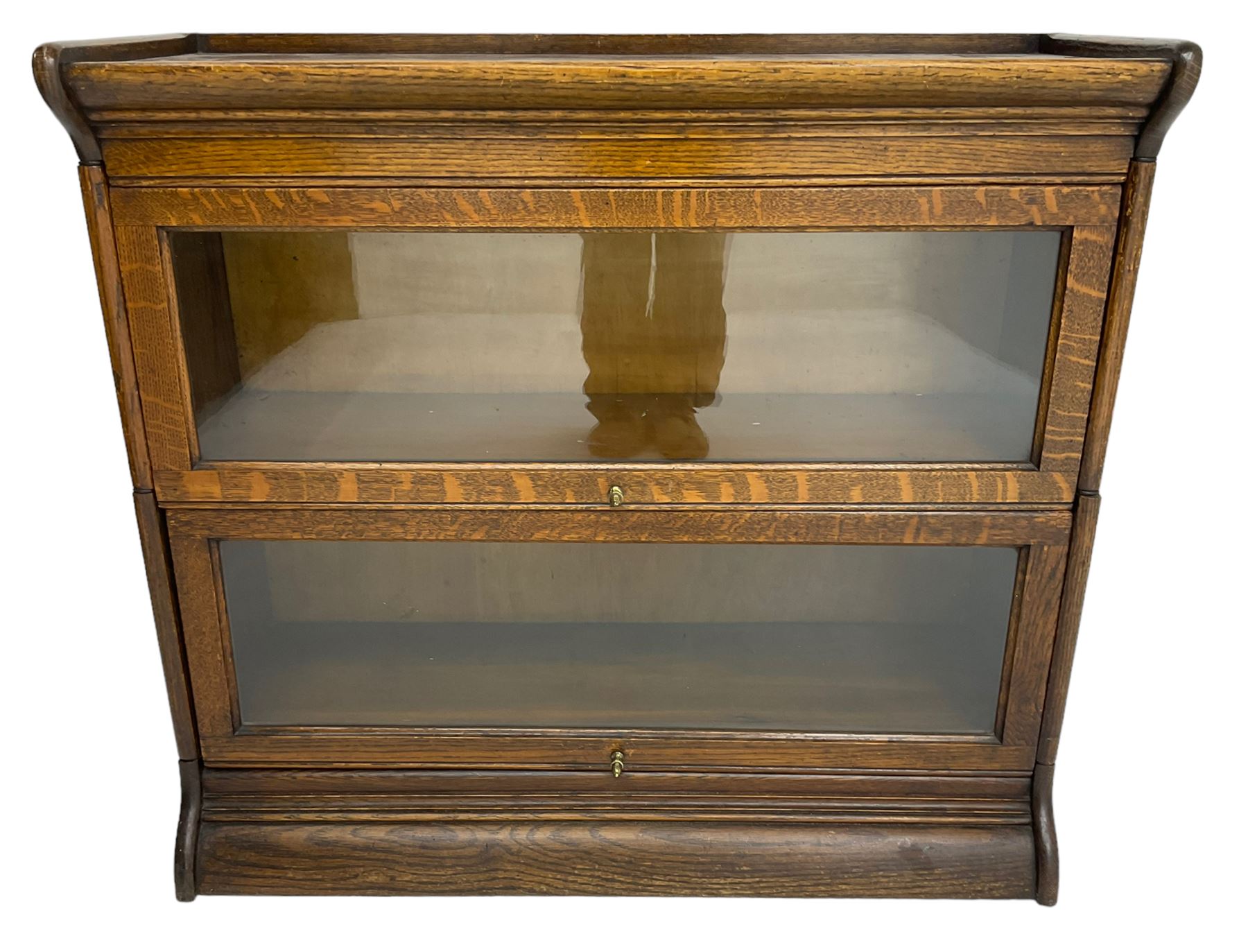 Globe Wernicke design - early 20th century oak two sectional library bookcase, enclosed by hinged and sliding glazed doors