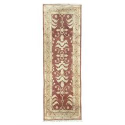 Persian Zeigler crimson ground runner rug, the field decorated with stylised foliate motifs and leafage, densely decorated guard band with floral and geometric patterns