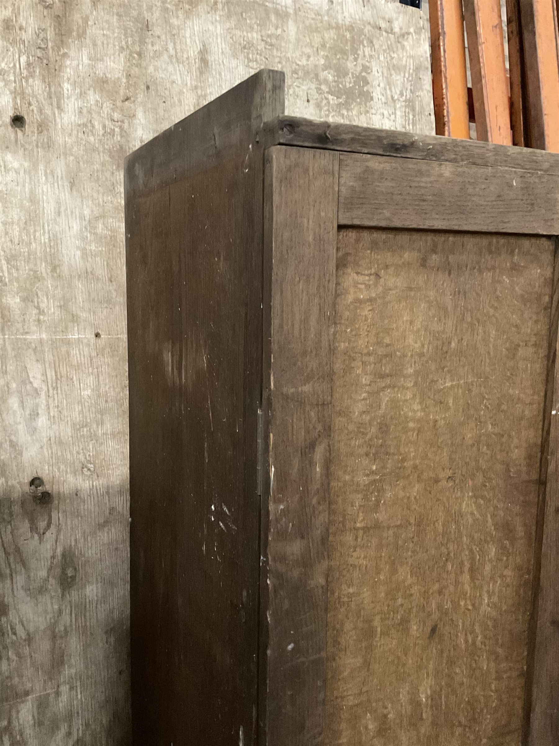 Early 20th century oak cupboard, enclosed by two panelled doors, the interior fitted with shelves and single drawer, on skirted base - THIS LOT IS TO BE COLLECTED BY APPOINTMENT FROM THE OLD BUFFER DEPOT, MELBOURNE PLACE, SOWERBY, THIRSK, YO7 1QY