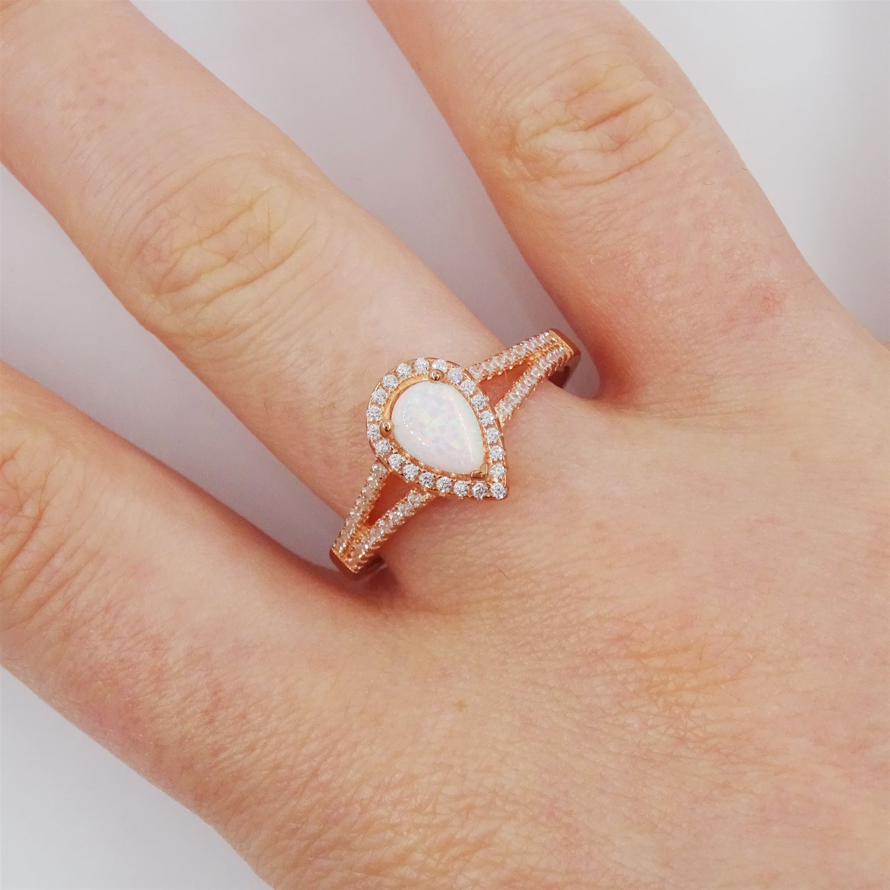 Rose gold on silver pear cut opal and cubic zirconia  cluster ring, stamped 925