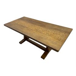 Rabbitman - oak dining table, rectangular adzed top, twin octagonal pillar supports on sledge feet, united by floor stretcher, carved with rabbit signature, by Peter Heap of Wetwang 