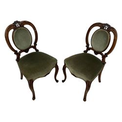 Pair of Victorian mahogany salon chairs, carved and pierced cameo back with scrolling acanthus leaf decoration and c-scrolls, upholstered in sage green fabric, on cabriole supports with floral mouldings