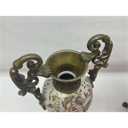 Wong Lee, twin handled ceramic urn with enamelled floral decoration and bronzed metal mounts, upon a square base, marked to base, together with similar twin handled urn with enamelled Cherub decoration, largest H44cm