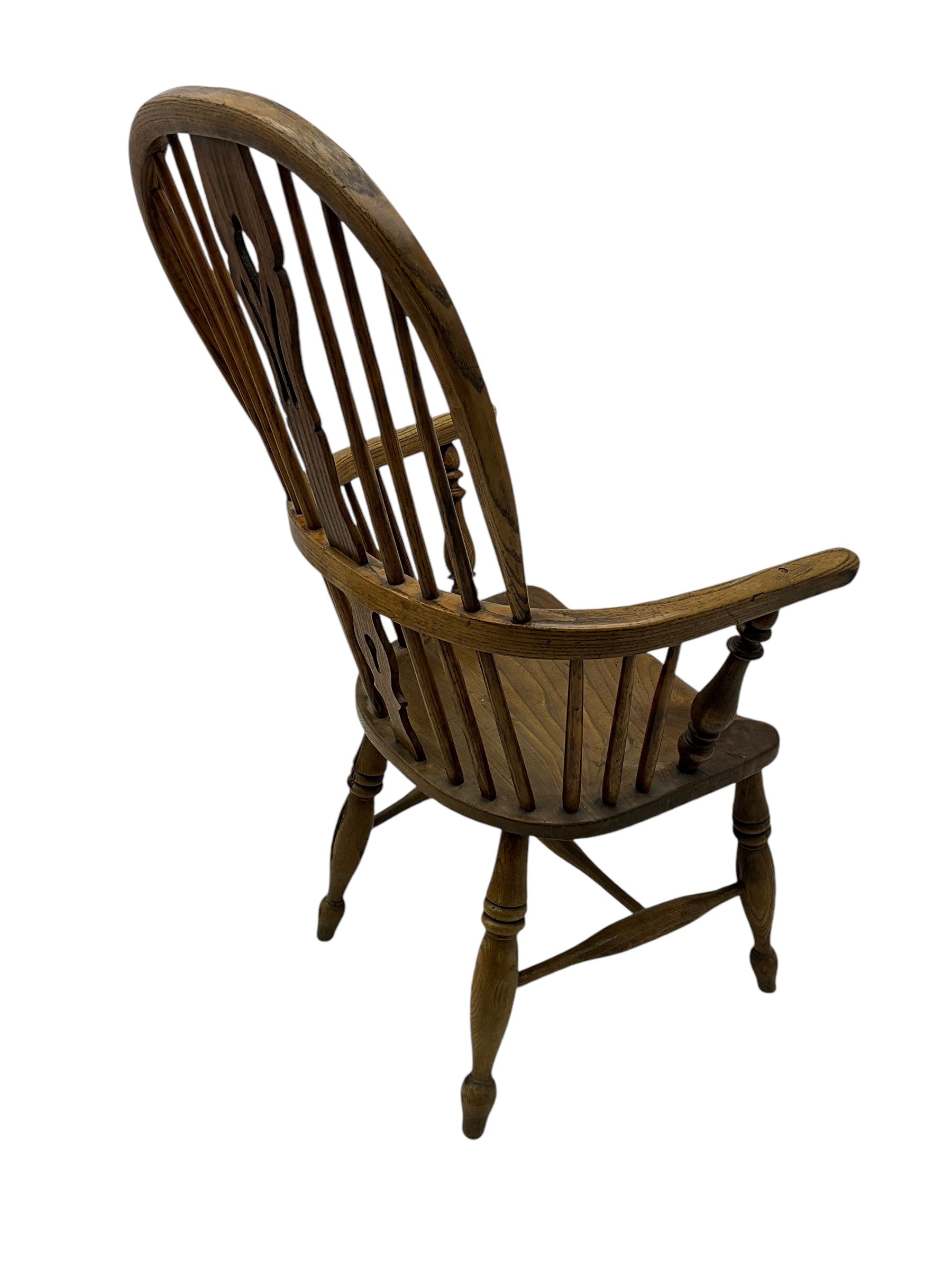 19th century elm and ash Windsor armchair, double hoop and stick back with shaped and pierced splat, on turned supports united by swell-turned H-stretchers (W60cm, H108cm); 19th century elm and yew wood Windsor chair (W57cm) (2)