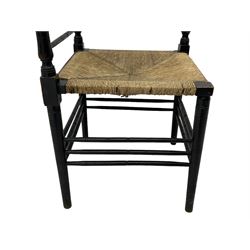 In the manner of William Morris - Arts & Crafts period corner chair, swell turned horizontal rails with balustrade back, rush seat on ring turned supports, black paint finish 