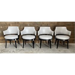 Four ebonised framed tub shaped armchairs, upholstered in grey fabric