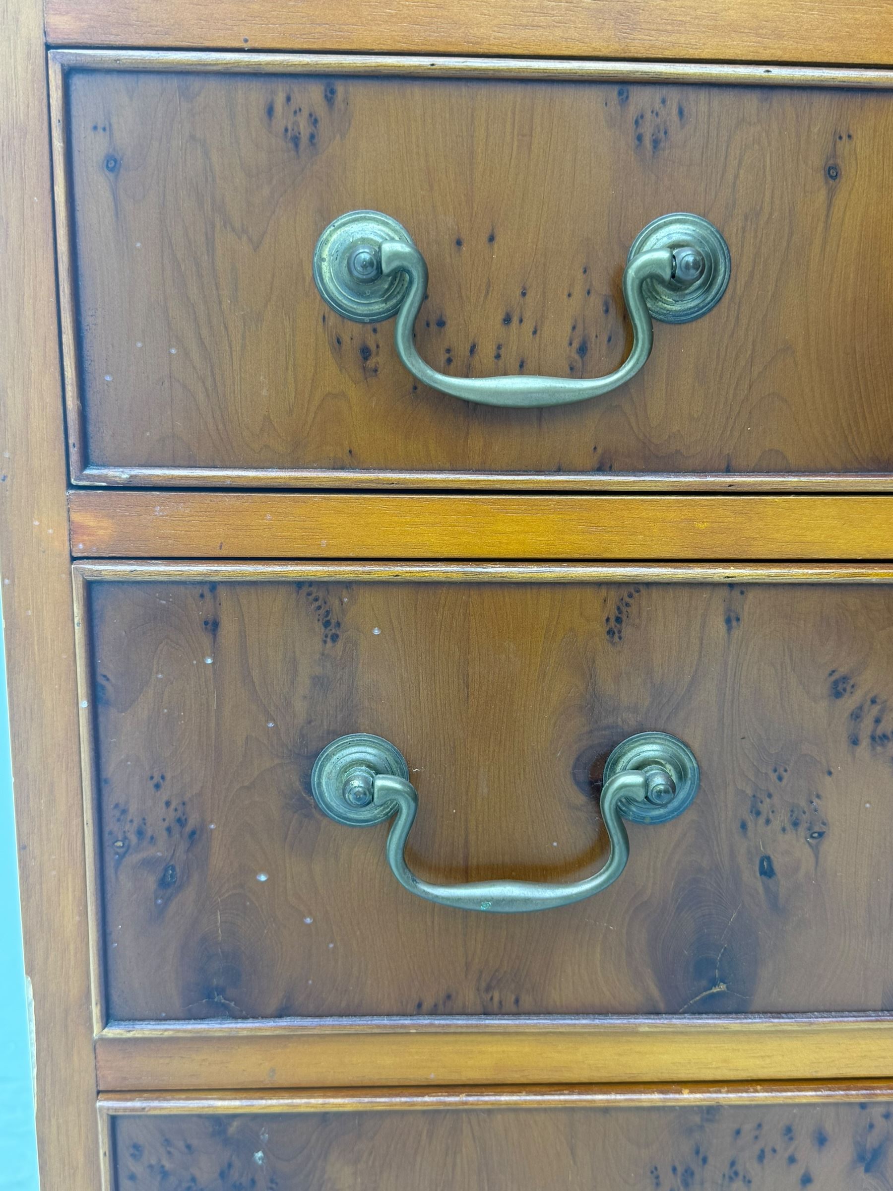 Mid-to-late 20th century yew wood bureau bookcase, raised bookcase enclosed by glazed door, the fall front revealing fitted interior, four graduating cock-beaded drawers below, on bracket feet