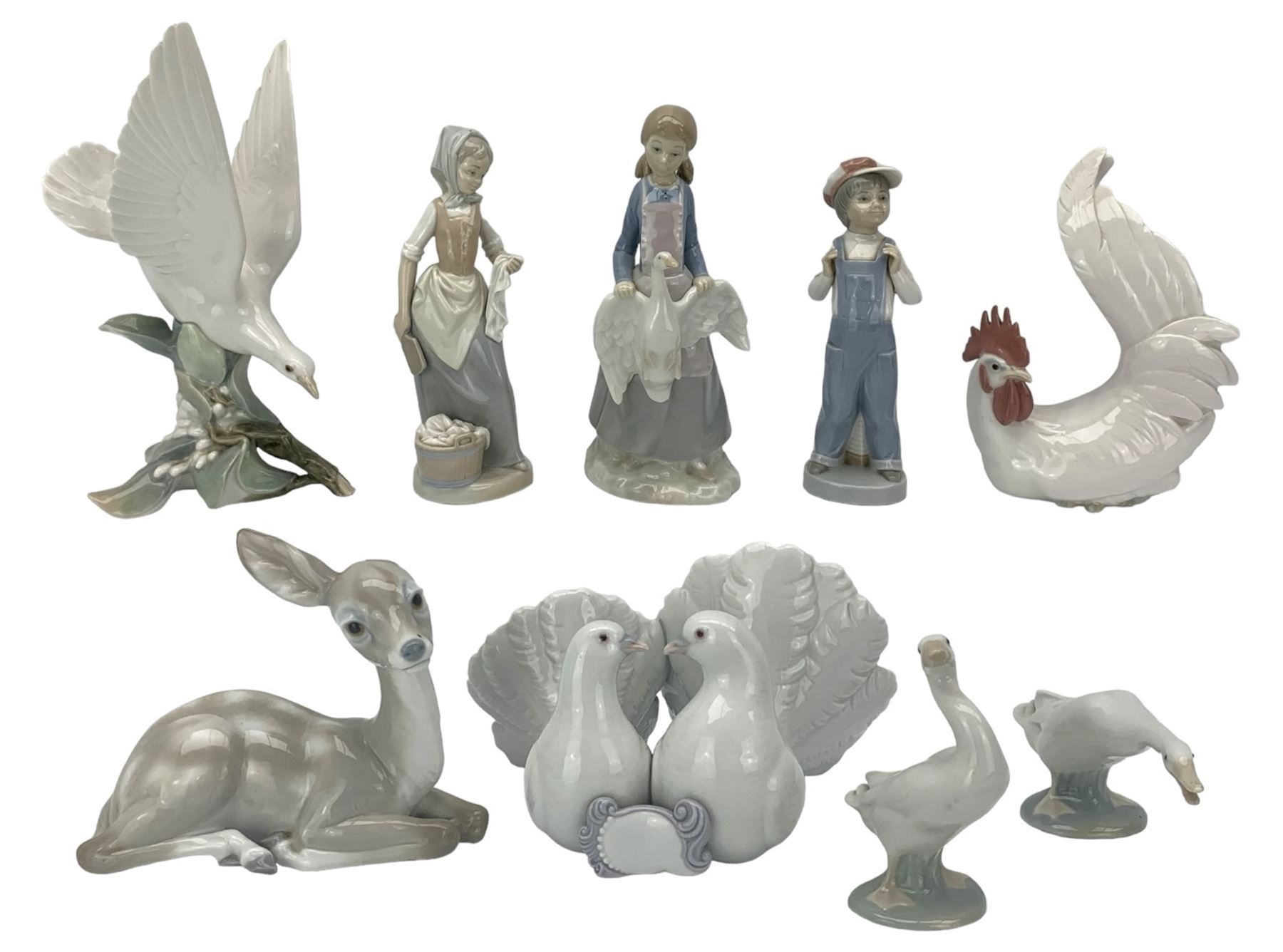 Seven Lladro figures including group of two doves, rooster, boy with accordion, deer, dove in flight , two geese and two Nao figures