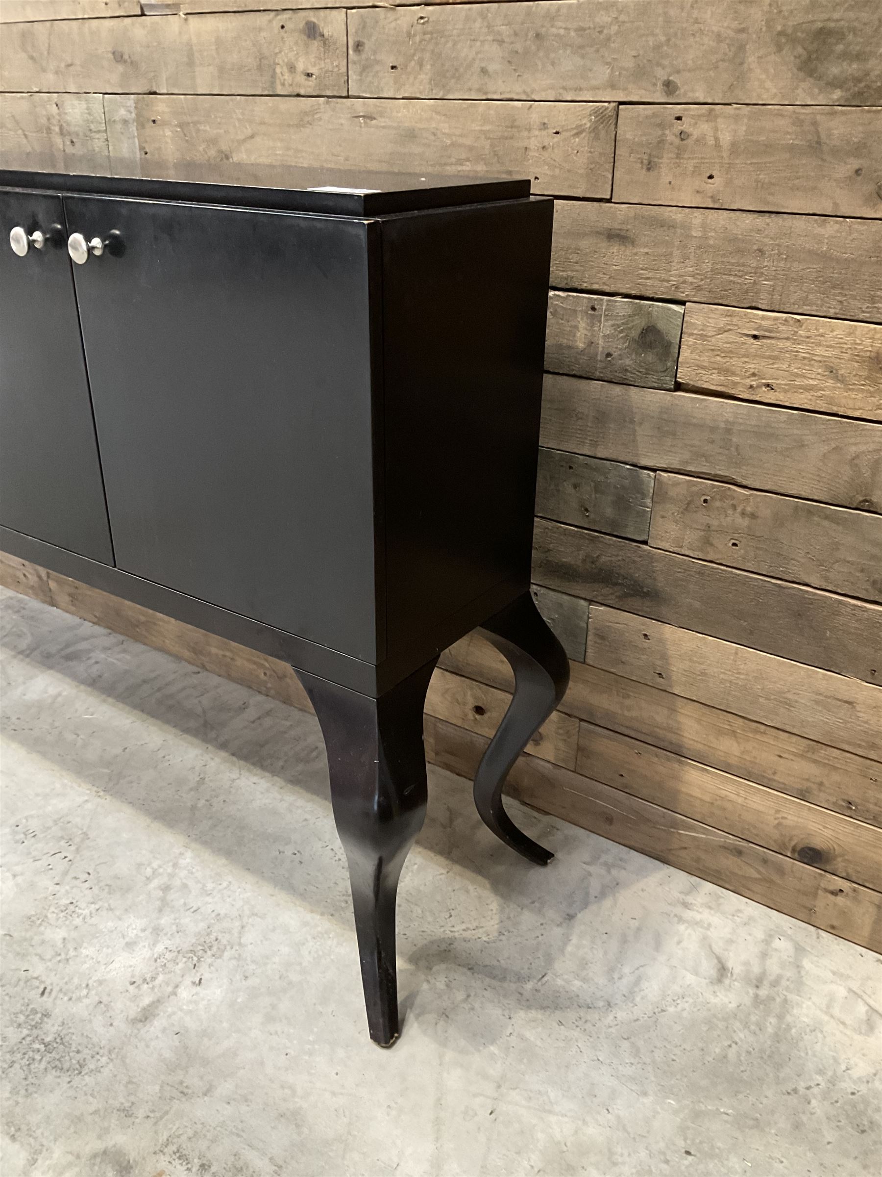 Rosewood finish four door sideboard, on cabriole legs