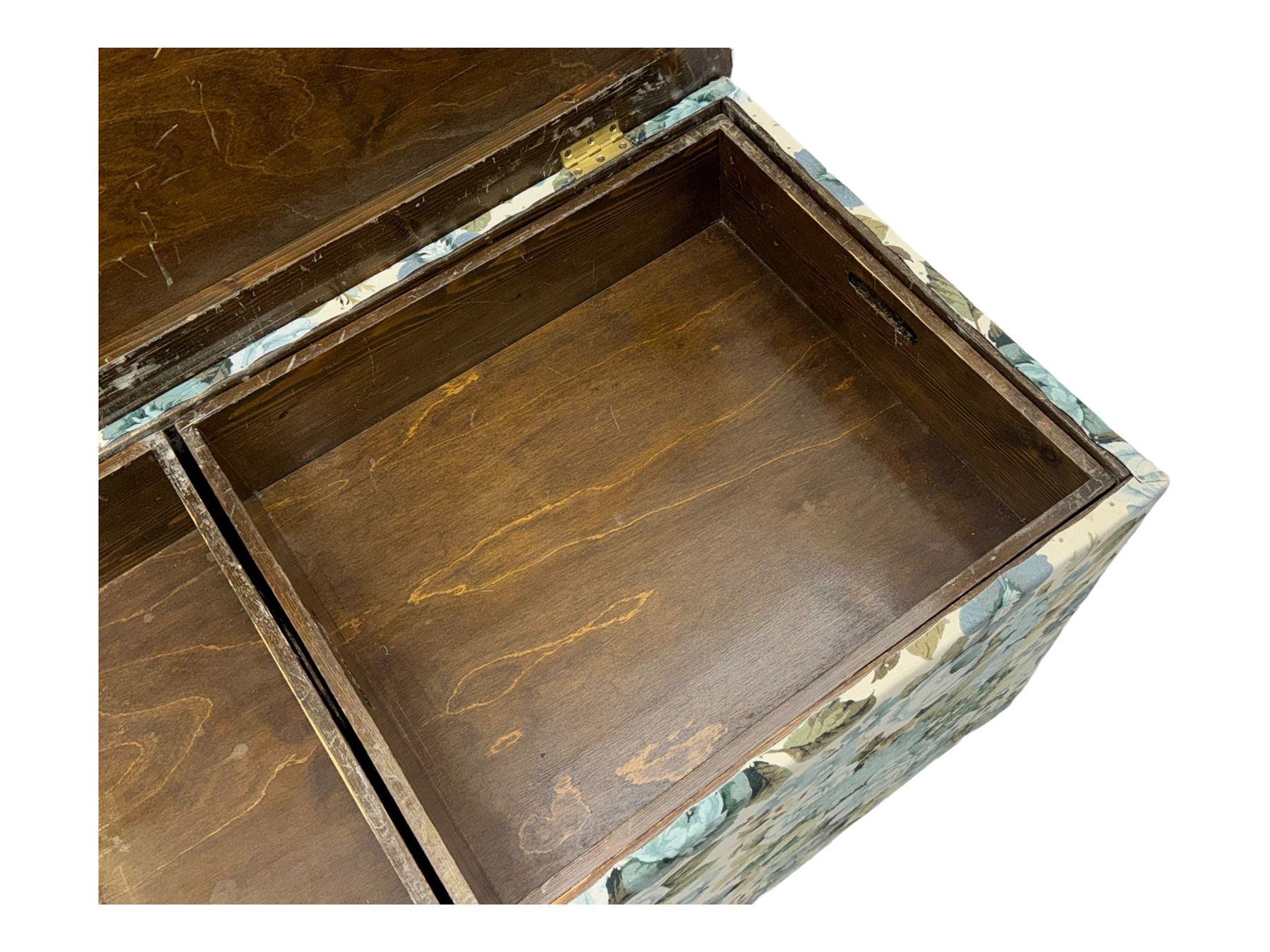 Mid 20th century oak blanket box, upholstered in floral pattern fabric, padded hinged lid enclosing oak interior with two removable trays, brass side handles, on round metal supports