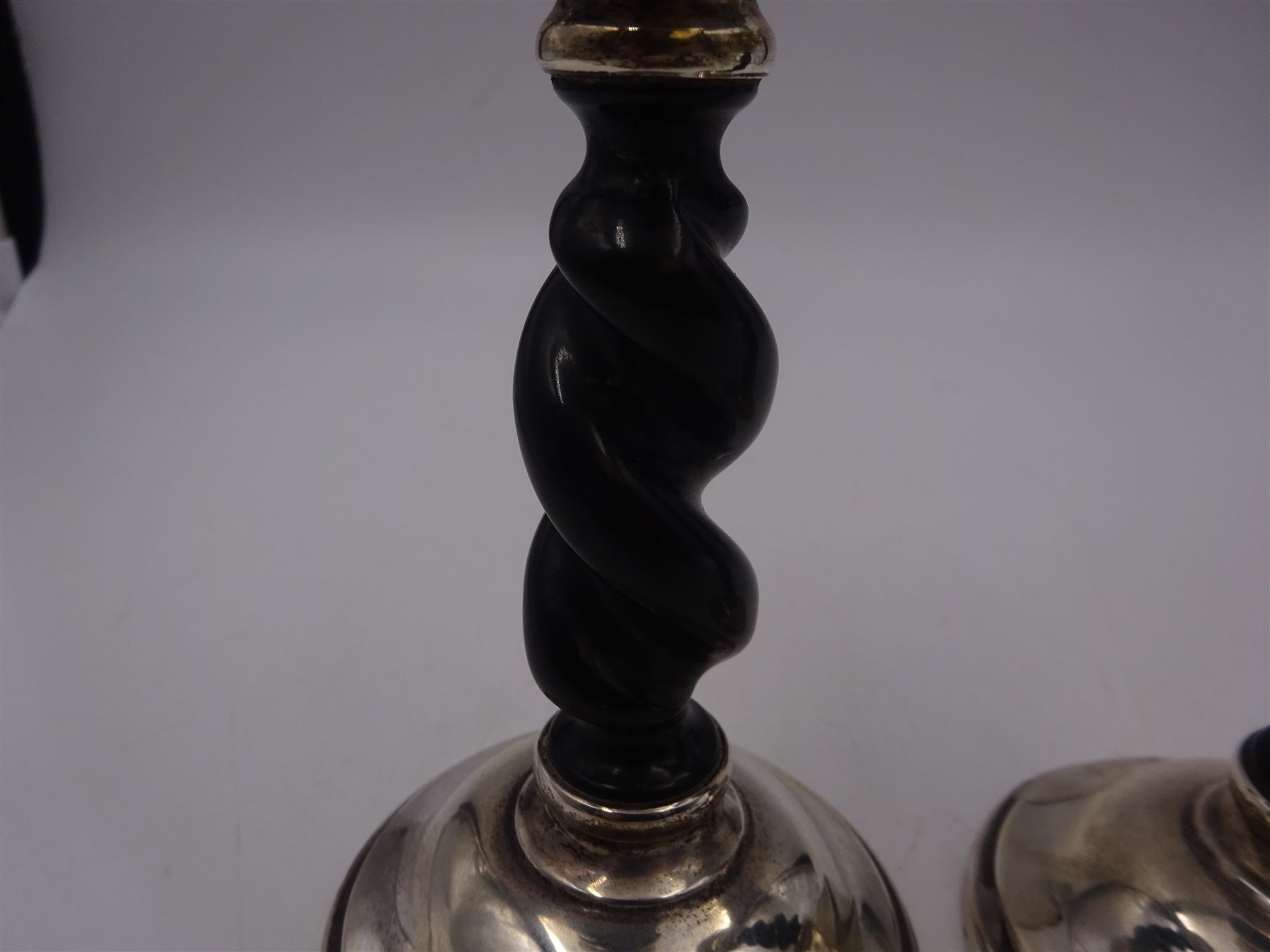 Pair of 1920s silver mounted ebonised barley twist candlesticks, hallmarked Payton, Pepper & Co, Chester 1927, H15cm