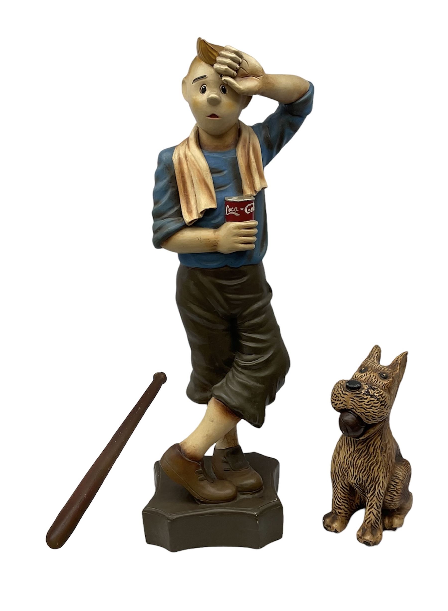 Fibreglass promotional/advertising figure of Herge's Tintin with baseball bat, standing mopping his brow and wearing plus-fours, a towel around his neck and holding a can of Coca-Cola H90cm; with similar figure of his dog Snowy seated with a baseball in his mouth (3)