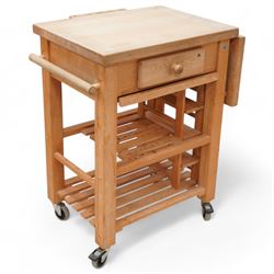 Late 20th century beech kitchen preparation trolley, rectangular drop-leaf butcher's block top, fitted with single drawer and knife slots, over two slatted tiers, on castors