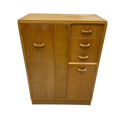 G-Plan - mid 20th century teak tallboy or combination wardrobe, left side with full-height hanging cupboard, right side with three drawers, the top fitted with vanity mirror, above cupboard with shelves, raised on a plinth base