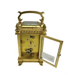 Early 20th century French carriage clock - 8-day timepiece movement in a decorative case with bevelled glass panels, white enamel dial with Roman numerals, minute markers and steel hands, retailed by Smith and Son, Scarborough, original lever platform escapement, with key.