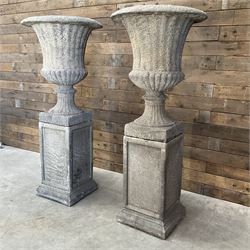 Pair of large Georgian design cast stone garden urns, egg and dart border, tapering column...