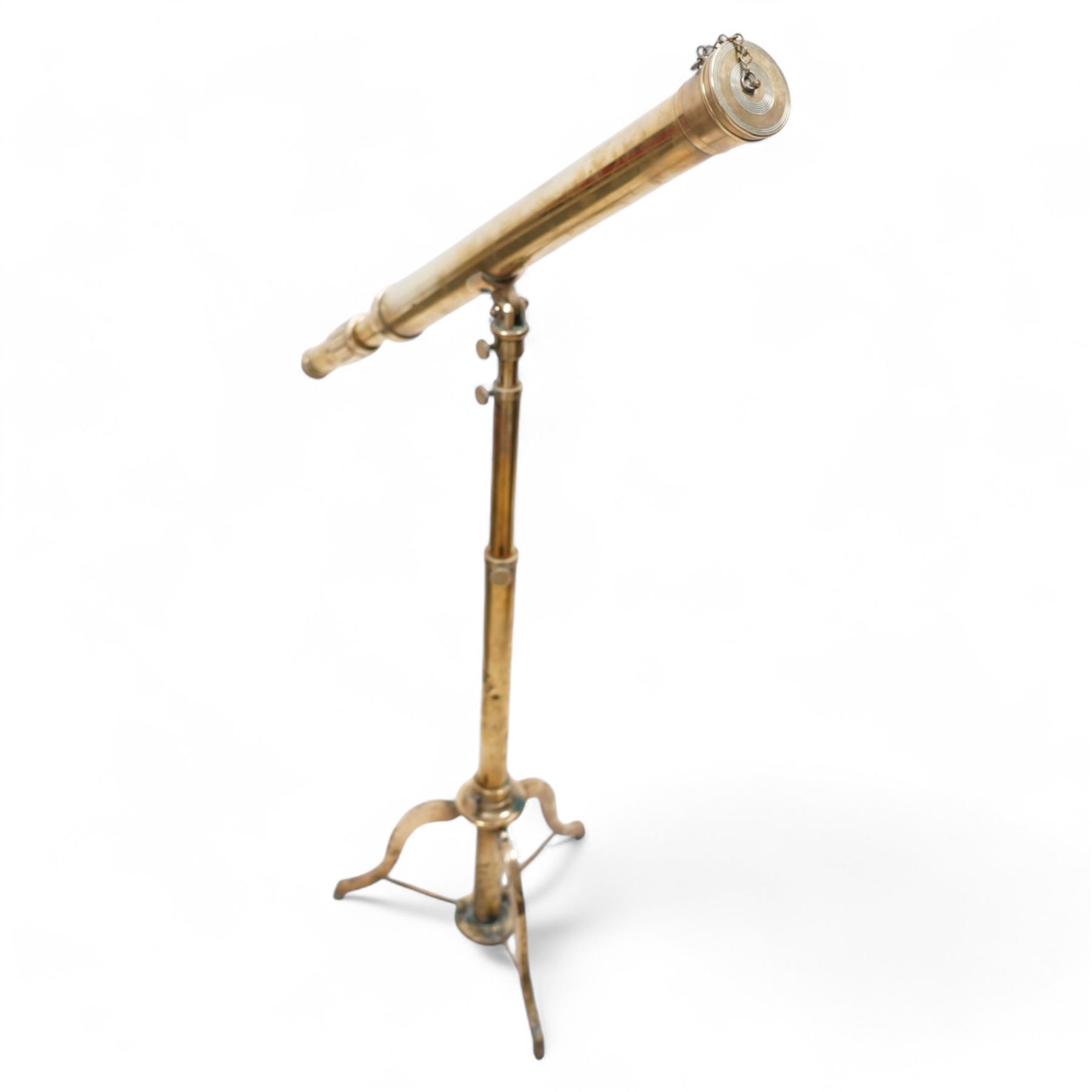 19th century lacquered brass telescope, the barrel on telescopic stem and tripod stand 