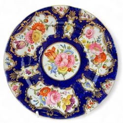 Pair of early 19th century plates, each painted with summer flowers within gilt fan shaped reserves, against a blue scale ground, unmarked, D19cm, together with a 19th century English porcelain plate, pattern no. 2/1078 (3)