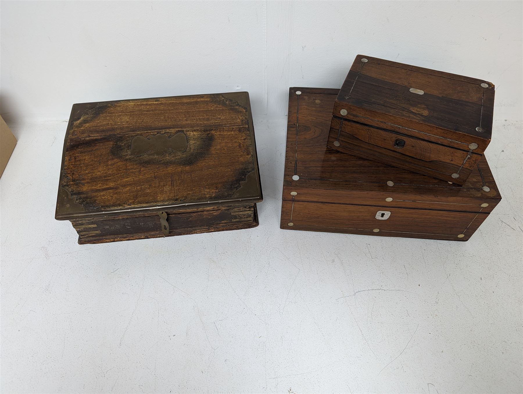 Brass bound wooden box, the hinged lid opening to reveal compartments, together with two other boxes 