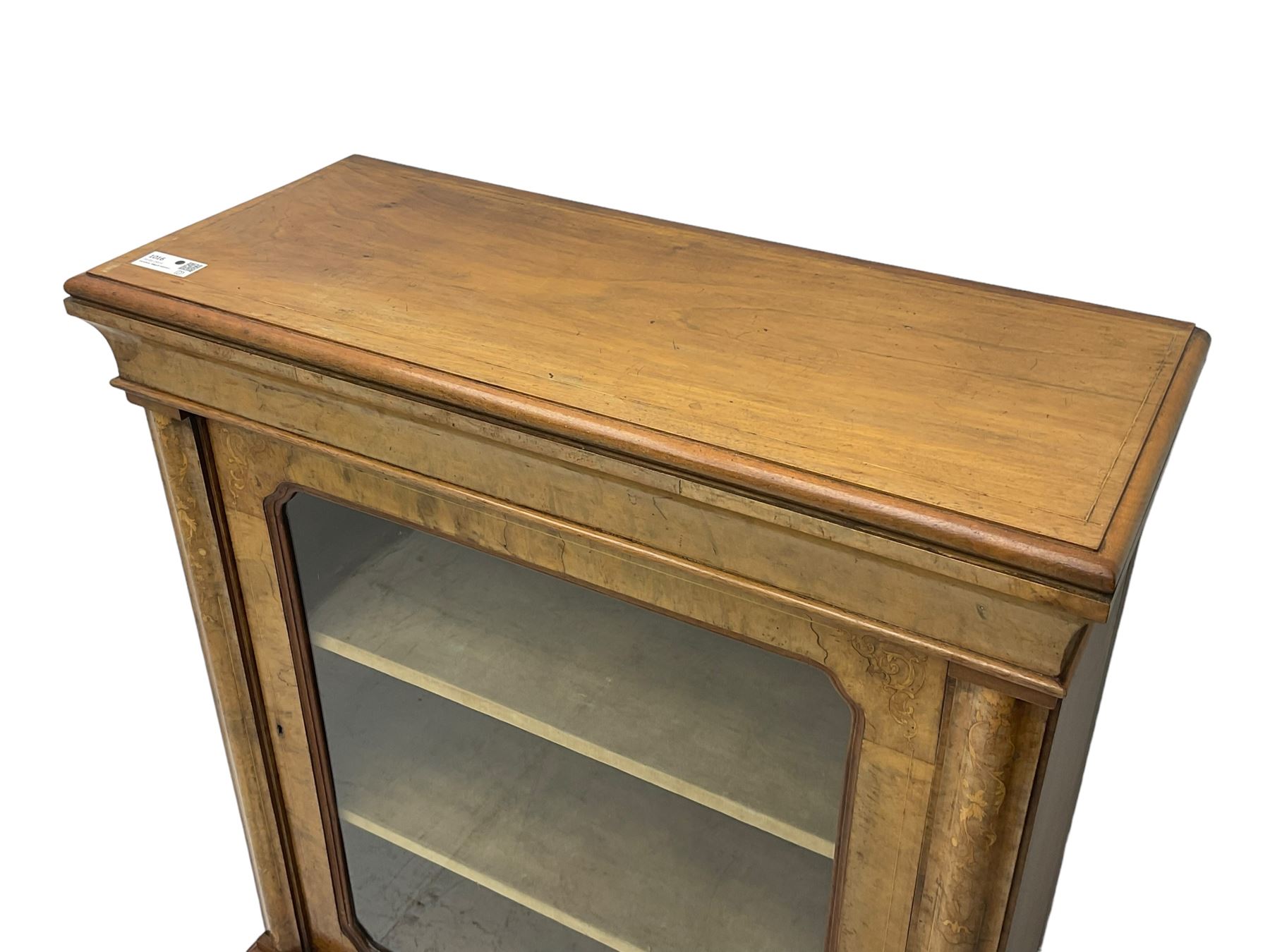 Victorian inlaid walnut pier display cabinet, moulded rectangular top over cavetto frieze, the moulded upright inlaid with scrolling foliage, fabric lined interior fitted with two shelves enclosed by single glazed door, on moulded plinth base 