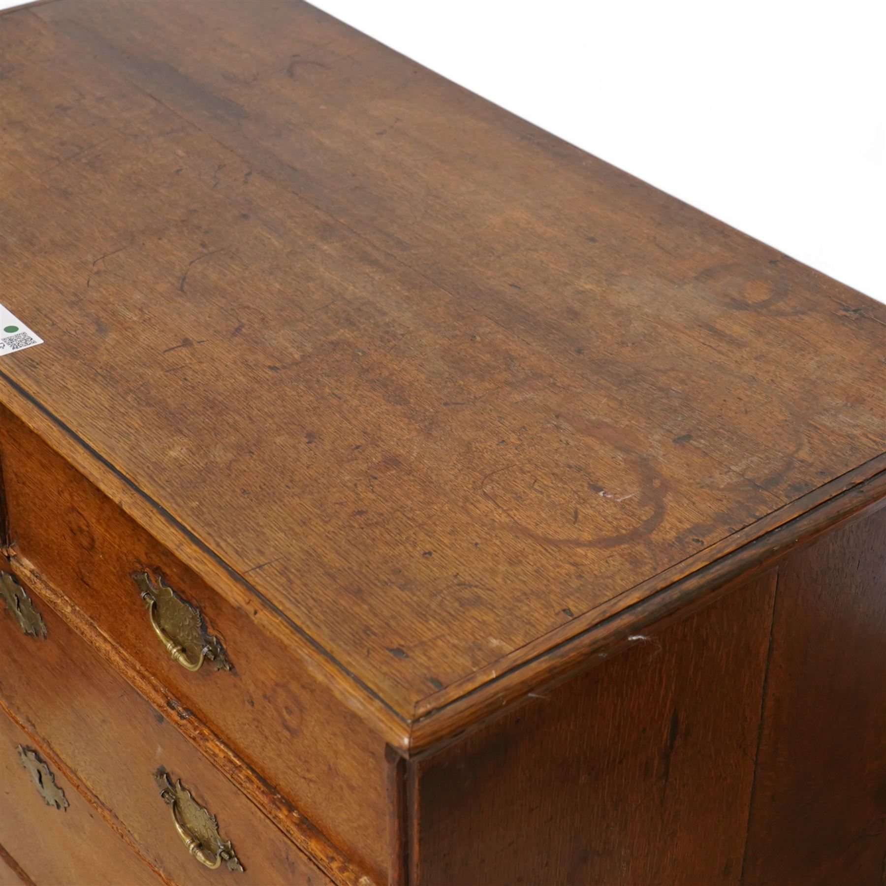 George III oak chest, moulded rectangular top over two short and three long drawers, shaped handles plates with engraved decoration, on bracket feet