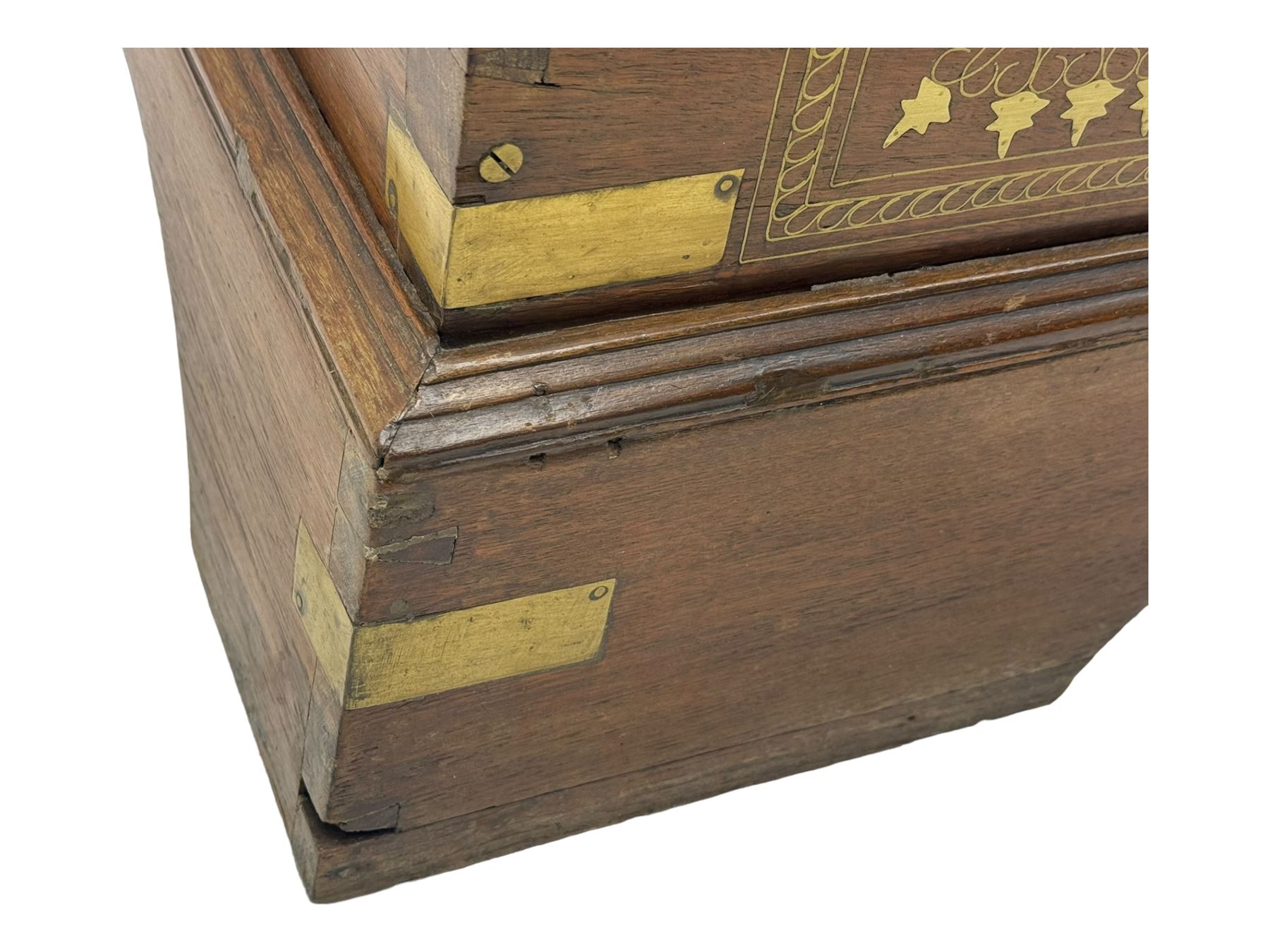 20th century mahogany chest, rectangular hinged top enclosing removable compartments with carved starburst motifs with linear and geometric patterns, brass inlay to the top and front, mounted corners and edges, on bracket base