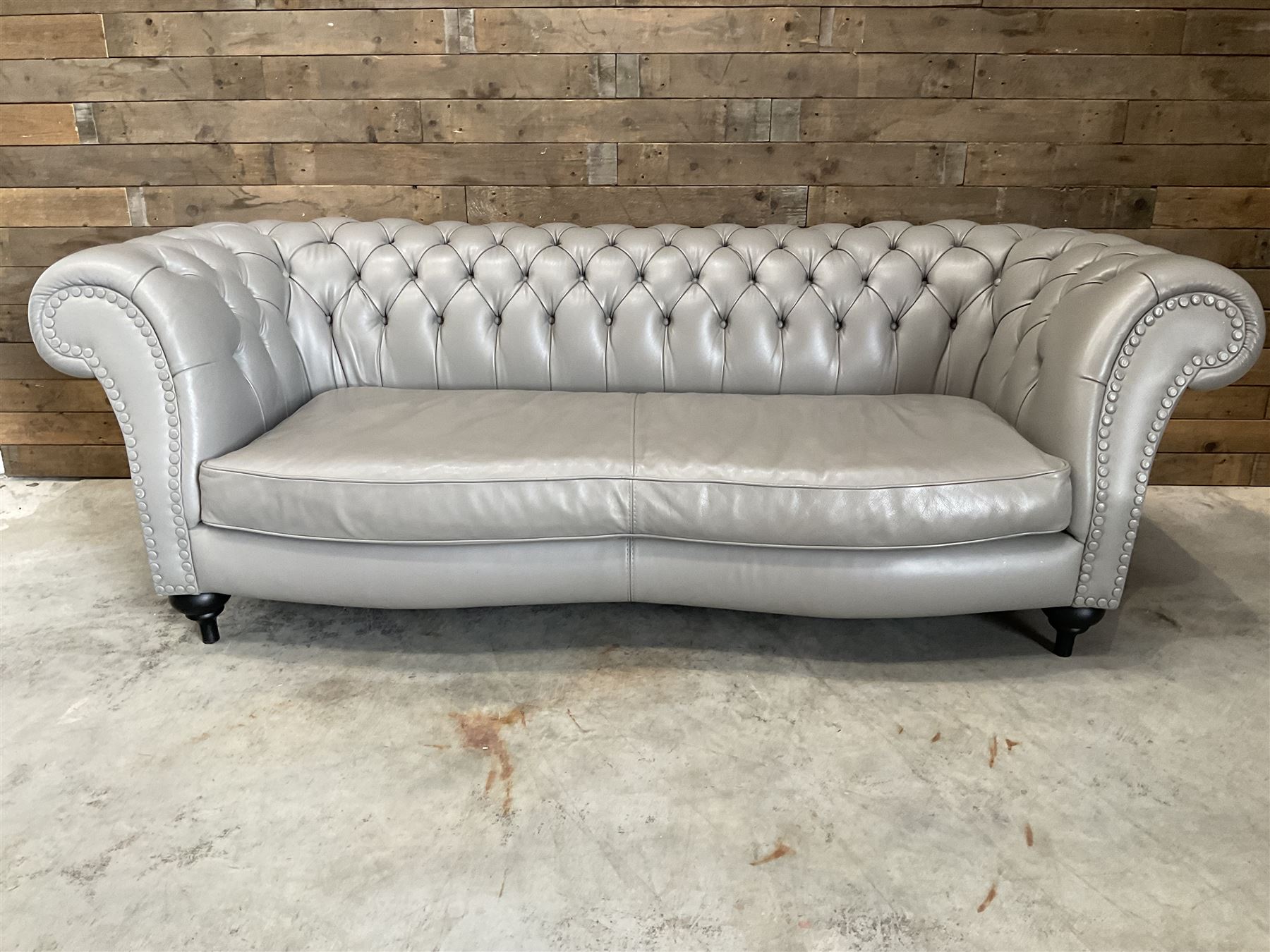 Three seat Chesterfield sofa, upholstered in grey buttoned leather