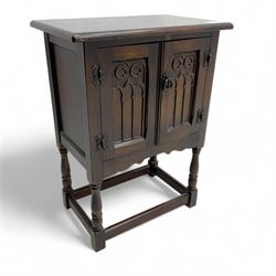 Early 20th century Gothic-style oak cupboard, rectangular top above two panelled doors wit...