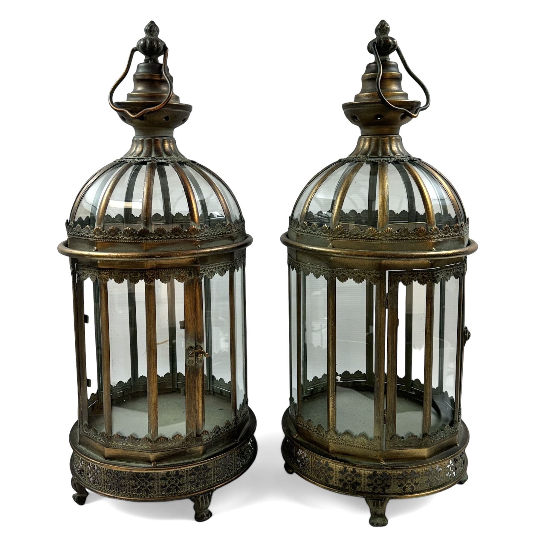 Pair of patinated brushed brass lanterns, of domed hexagonal form, with pierced gallery and swing handle, H63cm 


