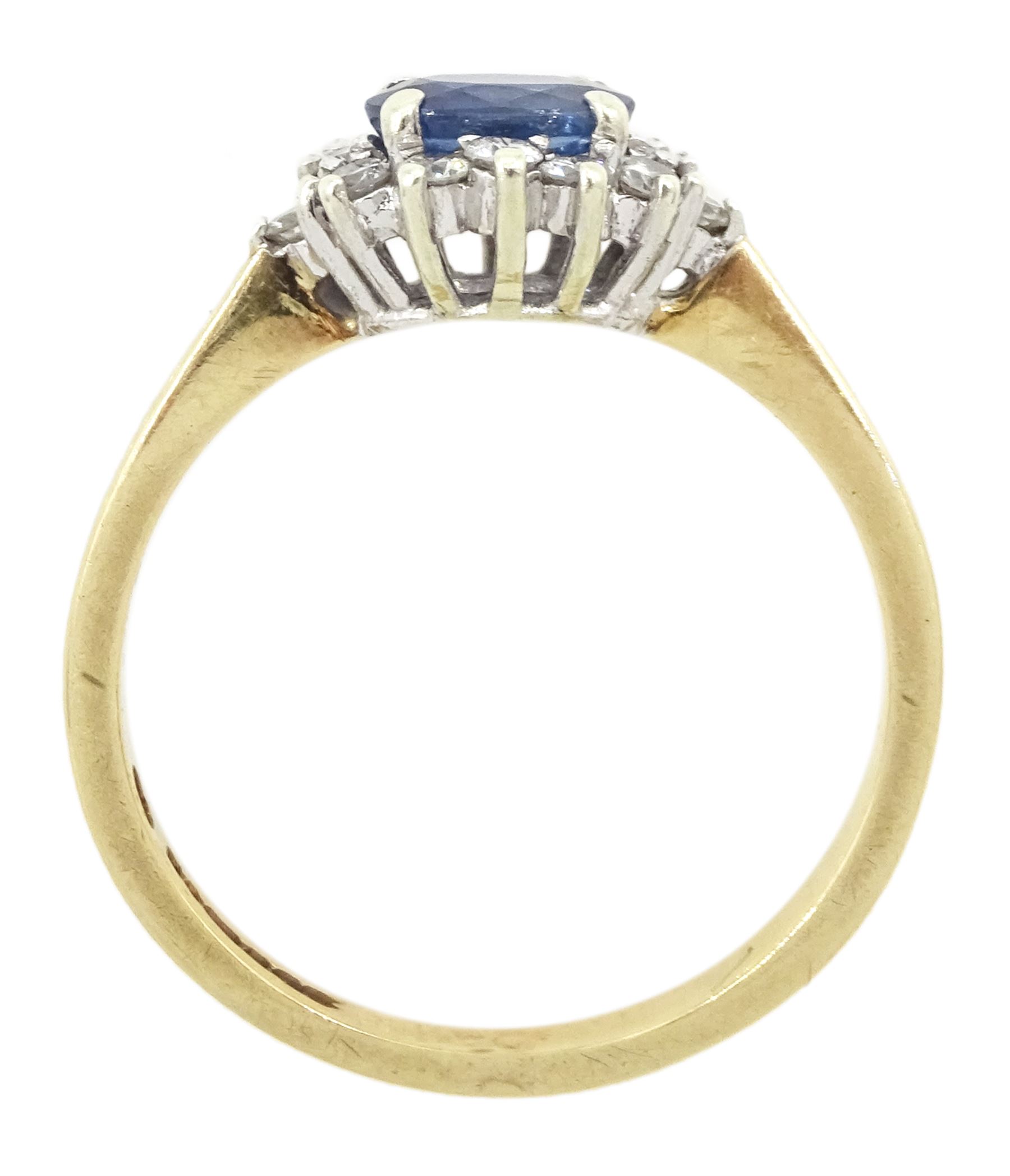 9ct gold oval sapphire and round brilliant cut diamond cluster ring, hallmarked London 1994, sapphire approx 0.55 carat, total diamond weight approx 0.25 carat