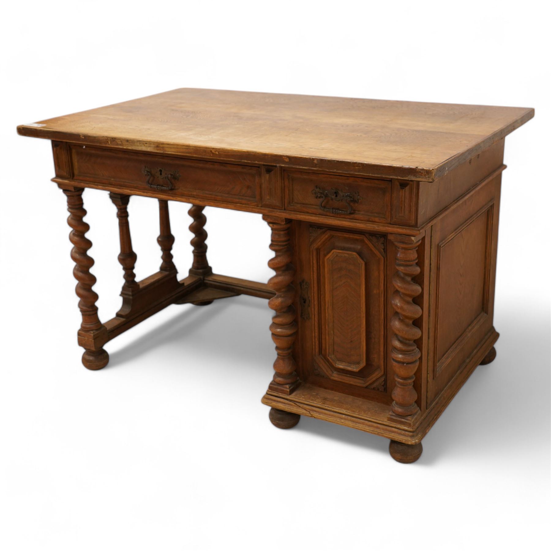 19th century oak desk, rectangular top over two drawers and cupboard, on spiral turned supports and turned bun feet