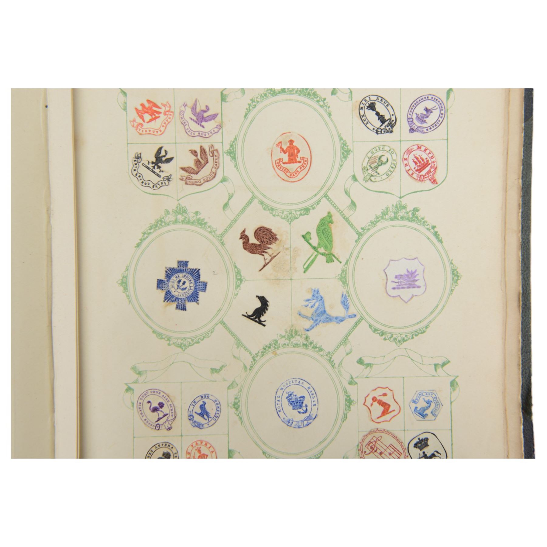 Victorian album of crests and monograms, including examples cut from envelopes and stamped into wax seals, with label to interior front cover reading 'Edward Law's Crest Collection Album 243' 