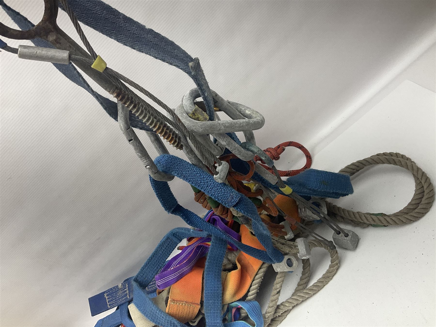 Collection of 1960s/70s climbing equipment including two original Hamish McInnes Pterodactyl ice axes, Joe Brown helmet, carabiners, ropes and wires etc