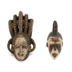 Two African polychrome painted African masks, largest H55cm