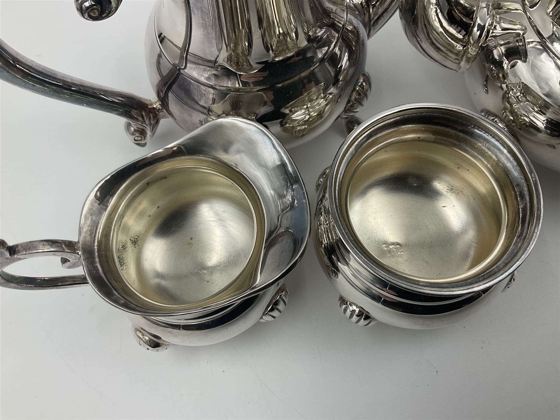 Miniature silver plated four piece tea service, comprising coffee pot, teapot, milk jug and sugar bowl, stamped GRC EPNS beneath, coffee pot H16cm