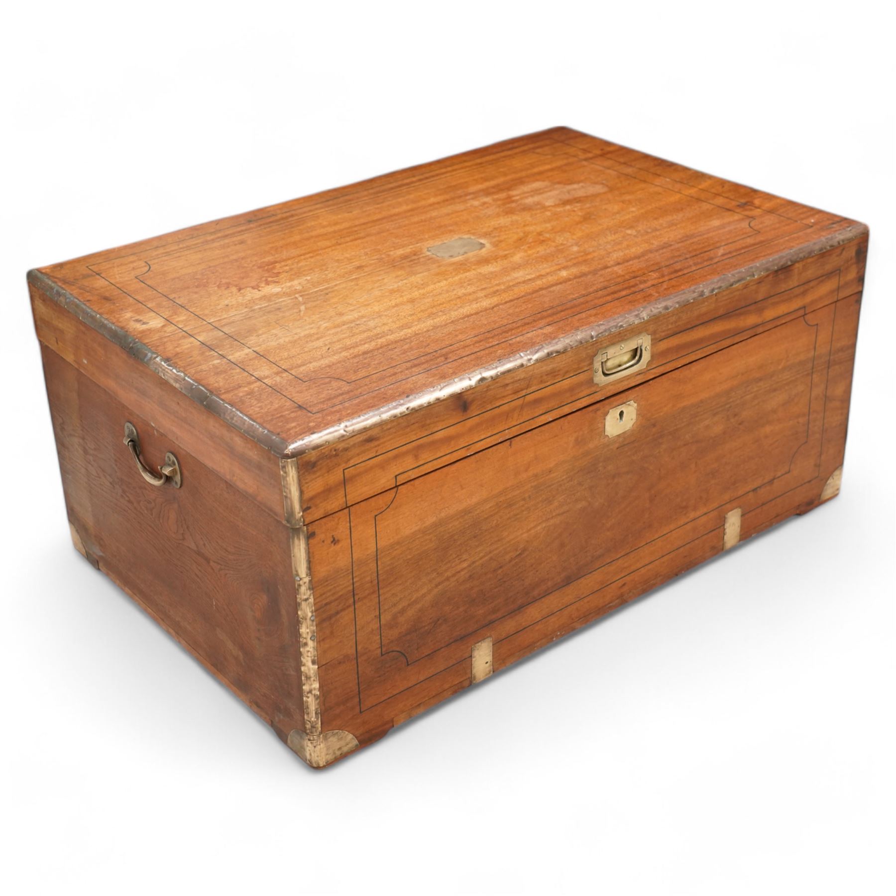 19th century camphor wood and brass mounted campaign chest, hinged lid with recessed brass handle enclosing vacant interior, mounted by brass edging and bands 