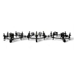 Set of three mid-20th century wrought iron six-light chandeliers, each with a circular fra...