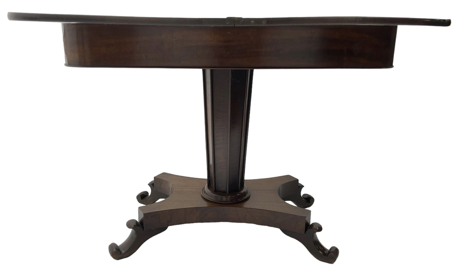 William IV mahogany tea table, rectangular fold-over top over banded frieze, tapering pedestal base with moulded vertical rails, on quadruform base with C-scroll feet