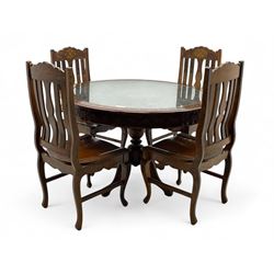 Pakistan carved hardwood brass inlaid circular dining table, and four rail back chairs wit...