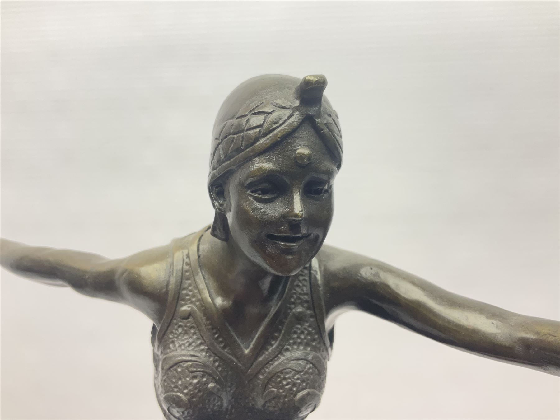 Art Deco style bronze, after Philipp, modelled as a dancer with her arms outstretched and one leg raised, on a veined marble tapering base signed Philipp and with foundry seal, H58cm