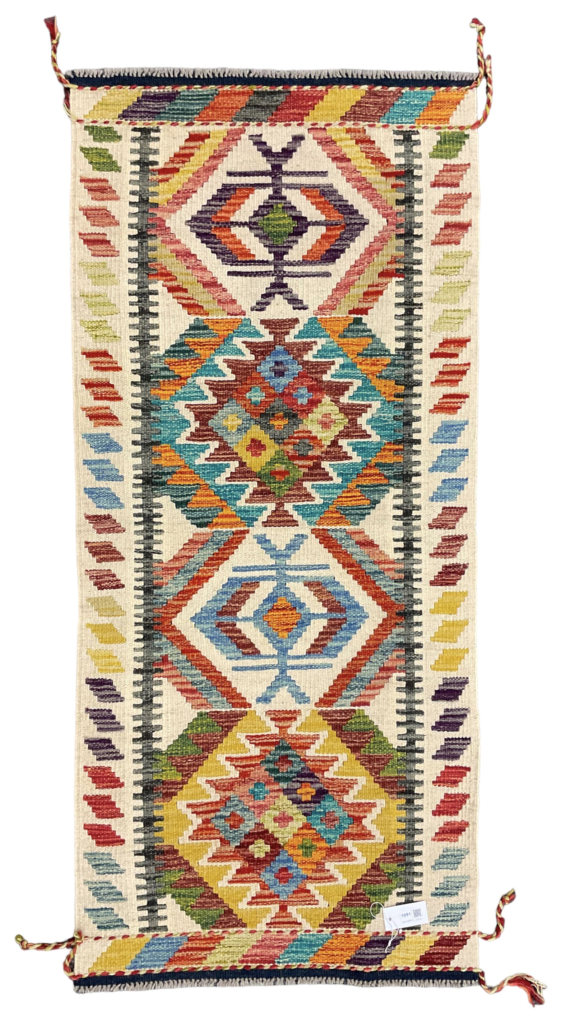 Chobi Kilim rug, pale ground and decorated with multi-coloured geometric pattern 